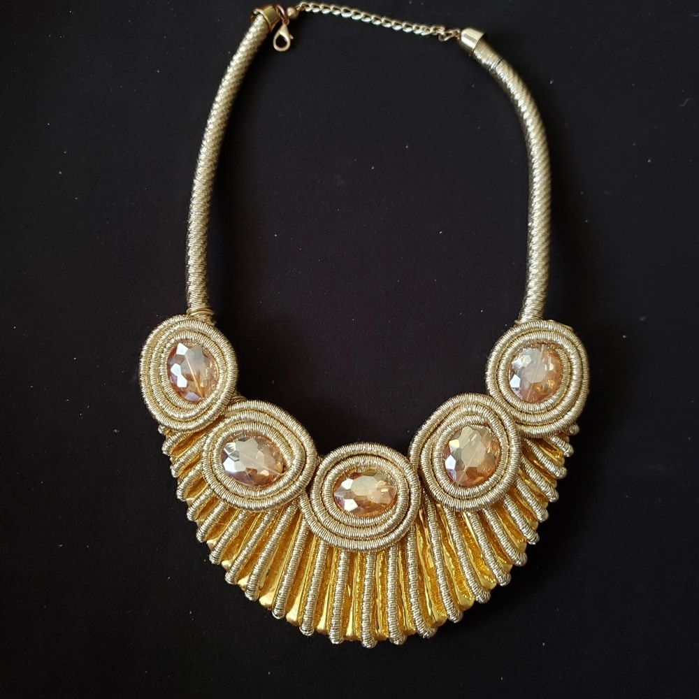 Gold colored neck piece